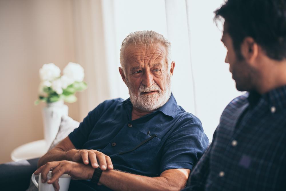 Man Talking To Adult Son