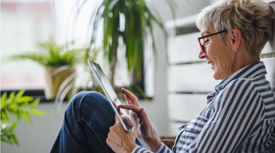 Women Sitting Looking At Tablet