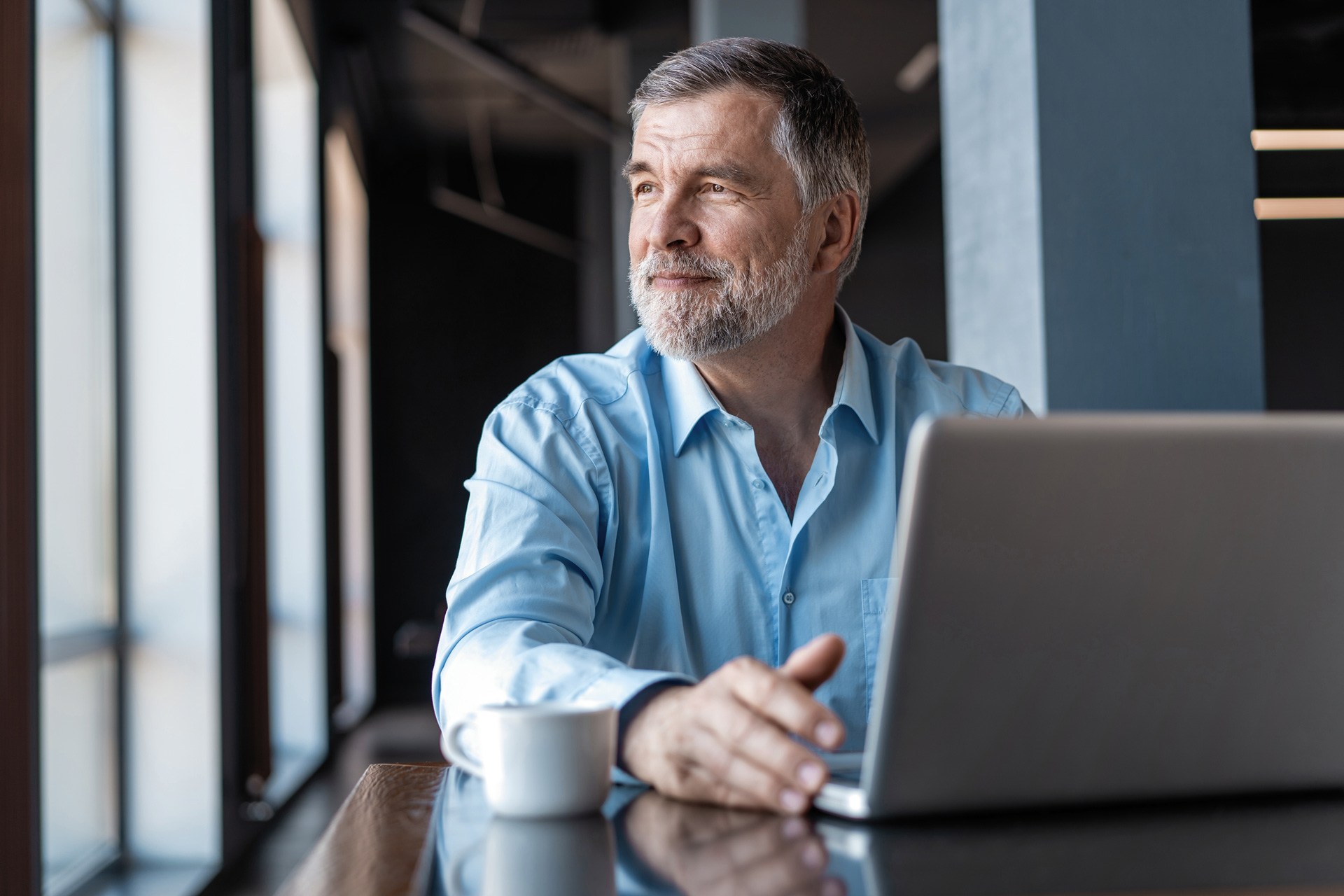 Man With Laptop Header